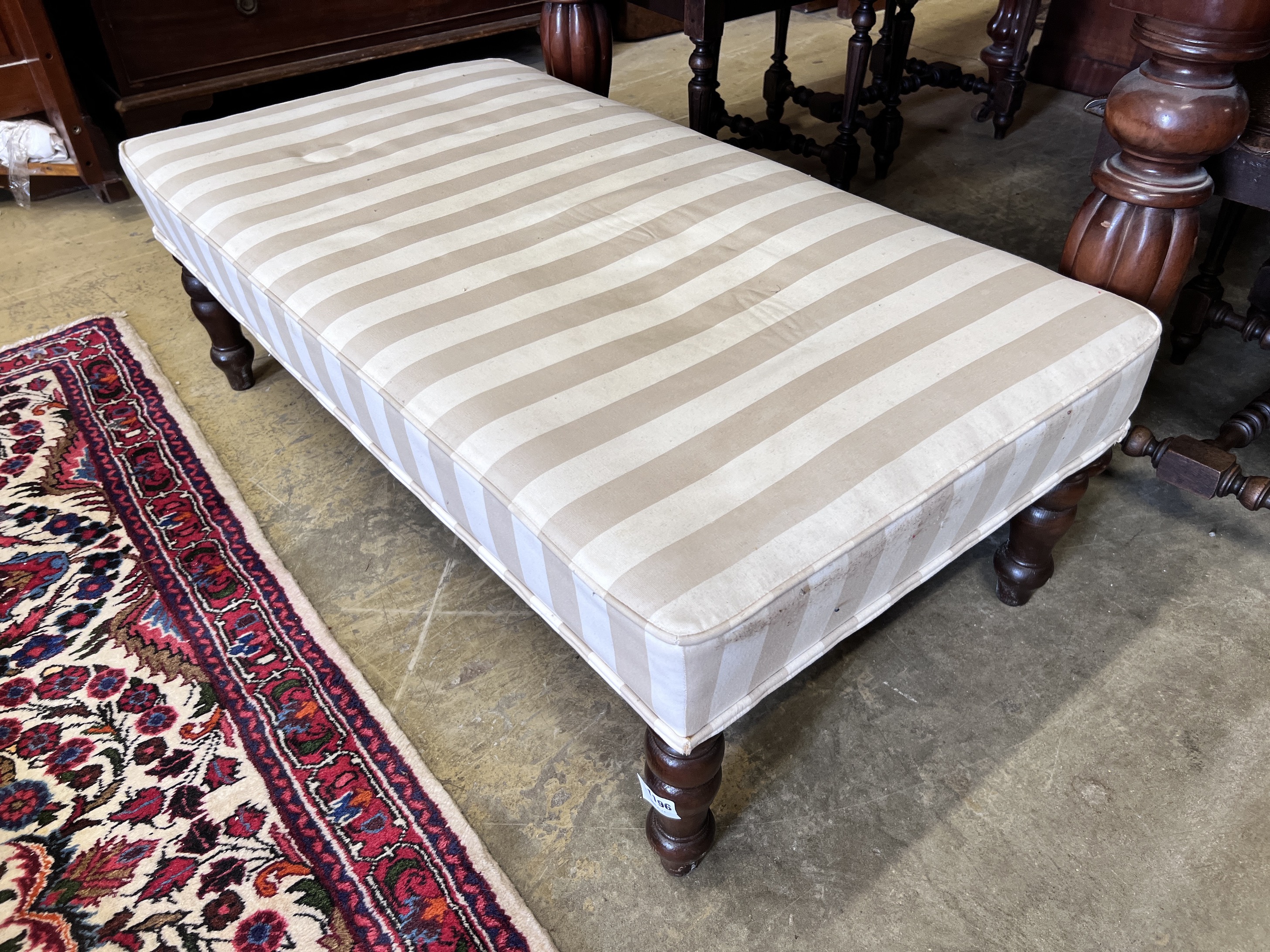 A Victorian style footstool with tray top, width 110cm, height 59cm